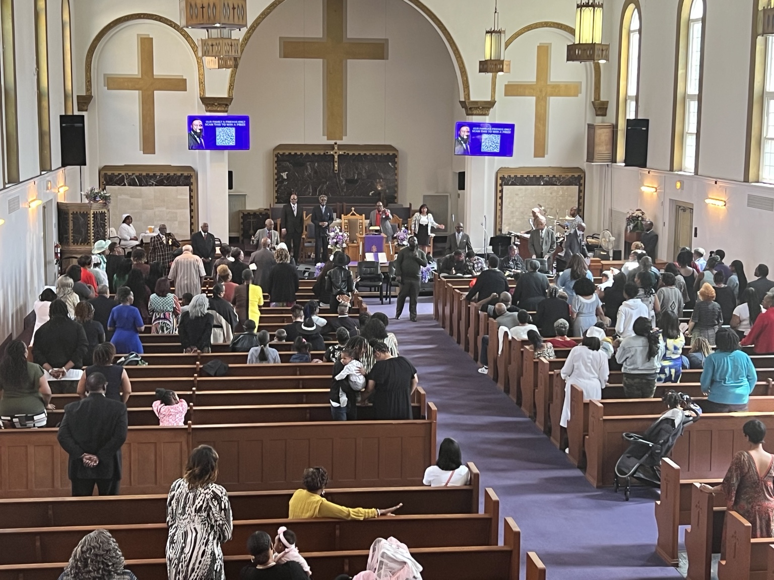Congregation worshiping inside the Second New Hope sanctuary